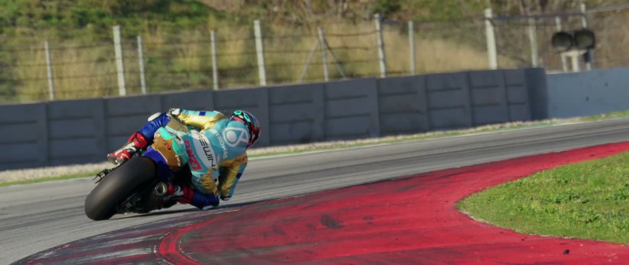 Motorcycle exiting a corner down the track